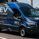 SEV HVAC & Plumbing custom vehicle wrap on a blue Ford Transit van featuring professional branding with white lettering, blue and gray design elements, service icons, and company tagline 'Comfort, Trust, Solutions' with DC monuments visible in background